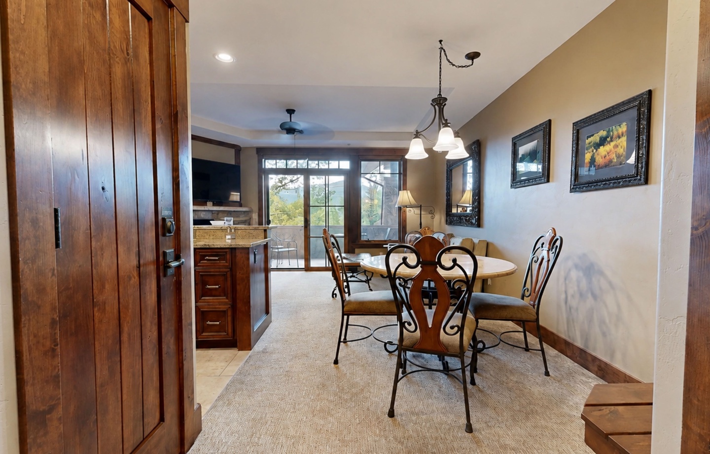Step into your inviting dining space, where warm wood tones and charming décor create the perfect setting for shared meals and memorable conversations with loved ones.