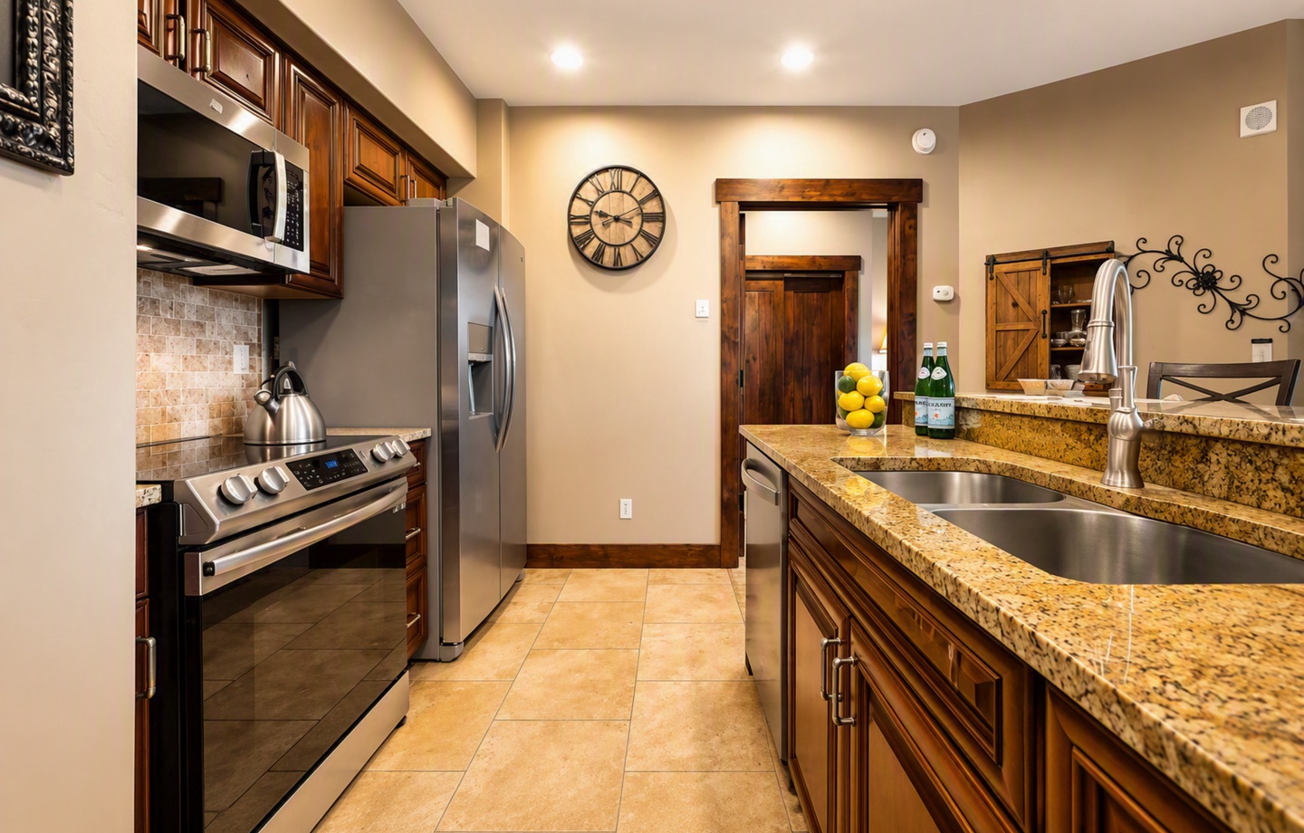 Step into your fully equipped kitchen with granite countertops, stainless steel appliances, and warm wood cabinetry. Everything you need to prepare delicious meals during your mountain getaway.
