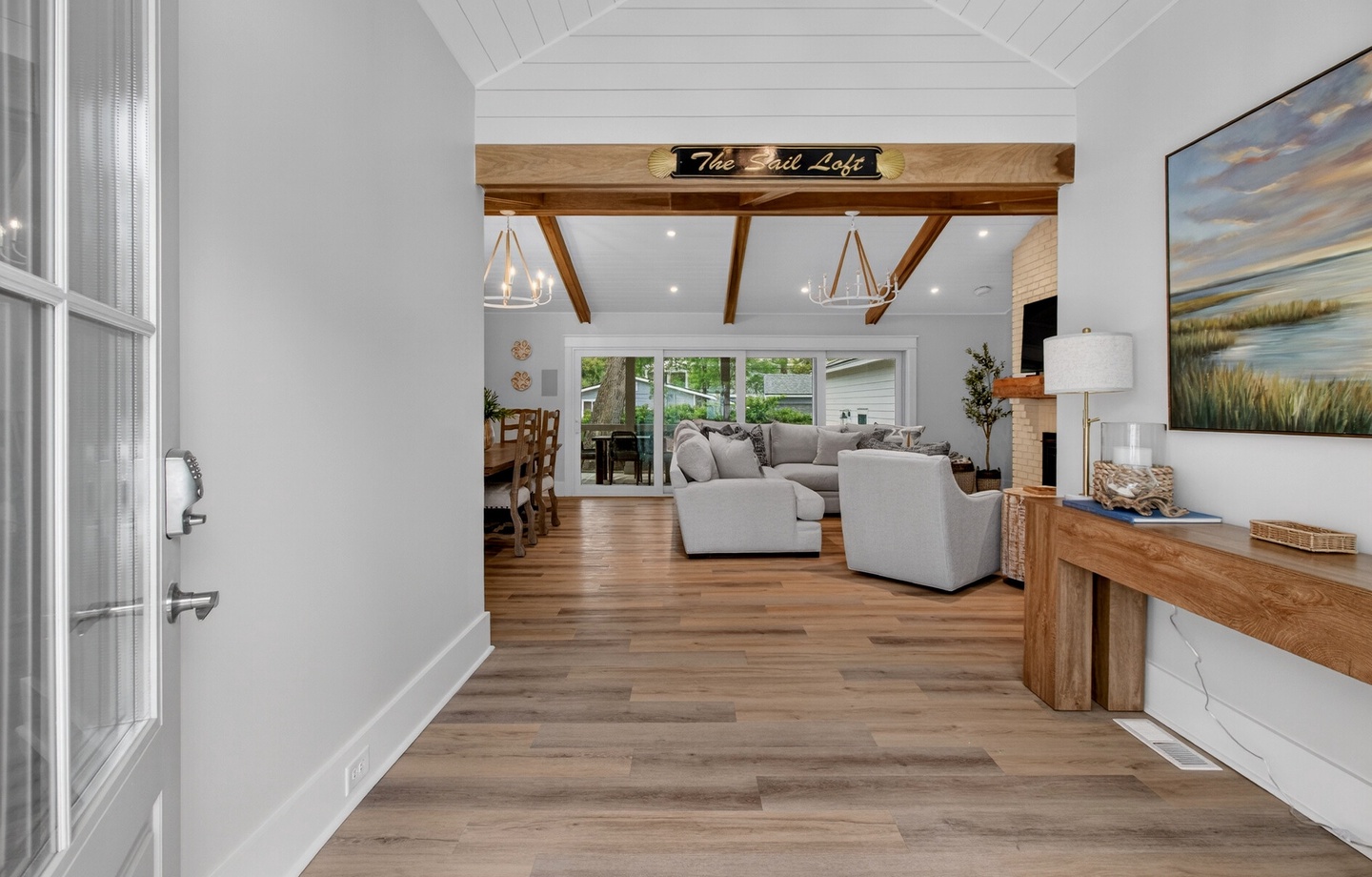 Step into your coastal retreat where rustic beams and soft grays create the perfect harmony for relaxation.