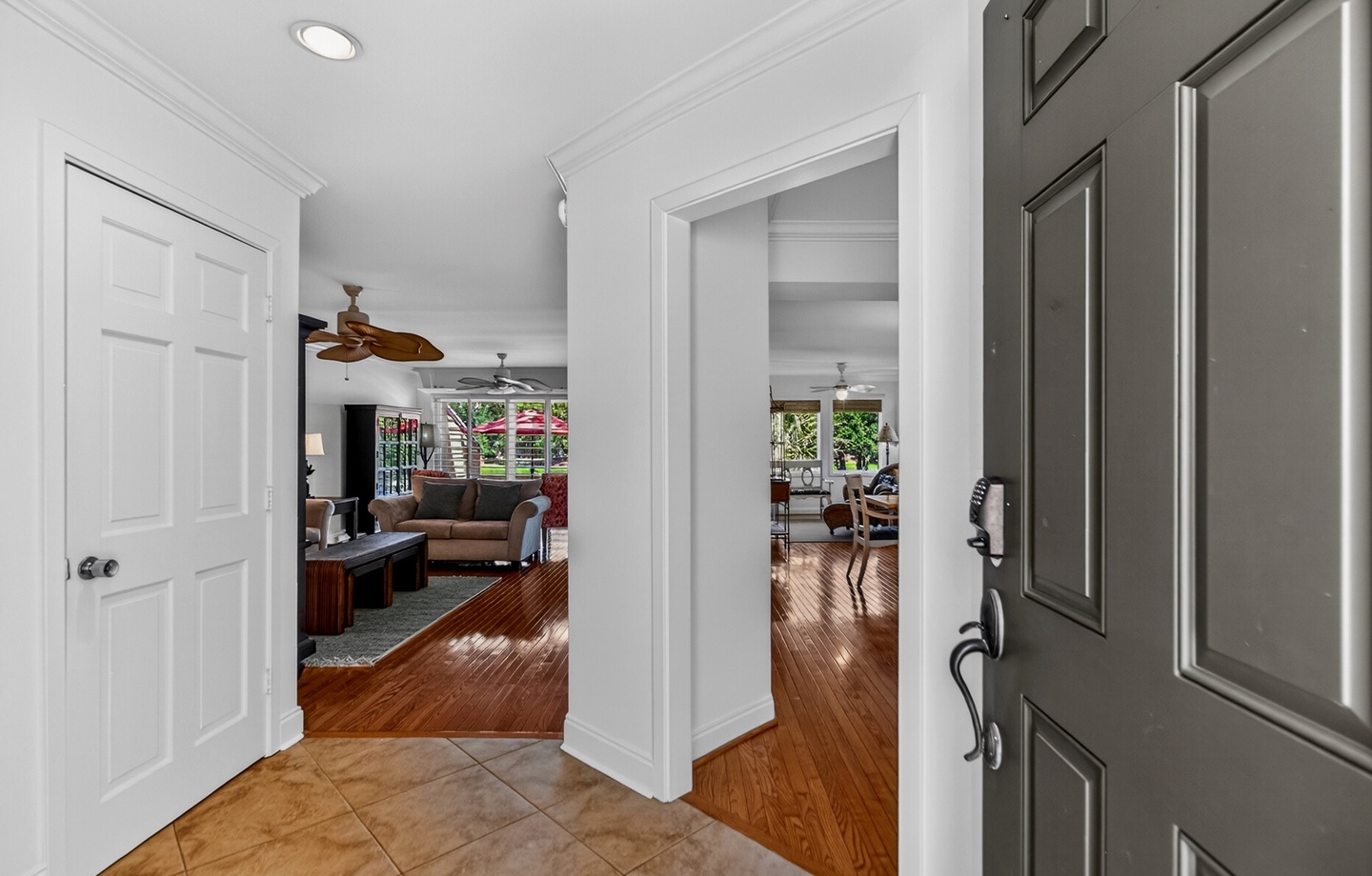 Step inside this bright, welcoming entryway with warm hardwood floors and views into the spacious living areas—your perfect starting point for a relaxing getaway.