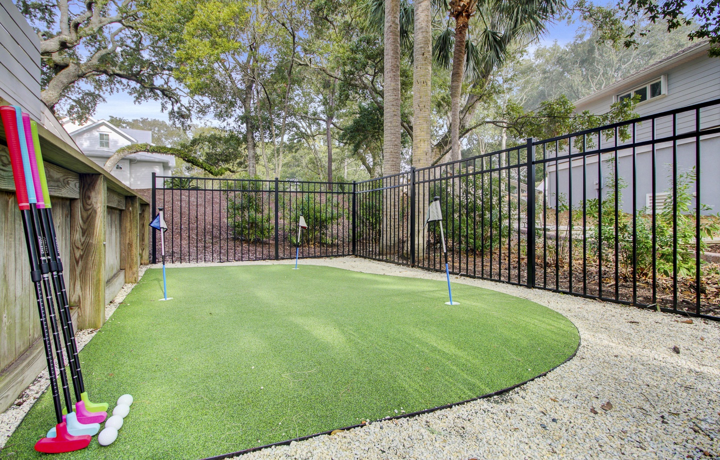Your private putting green awaits! Perfect your short game on this custom mini golf course, complete with colorful putters for friendly family competitions.