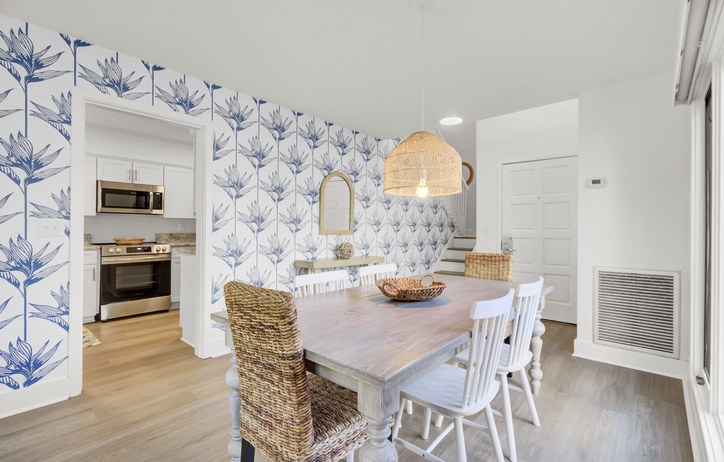 Gather around this charming dining table where coastal elegance meets comfort, perfect for memorable meals with loved ones.