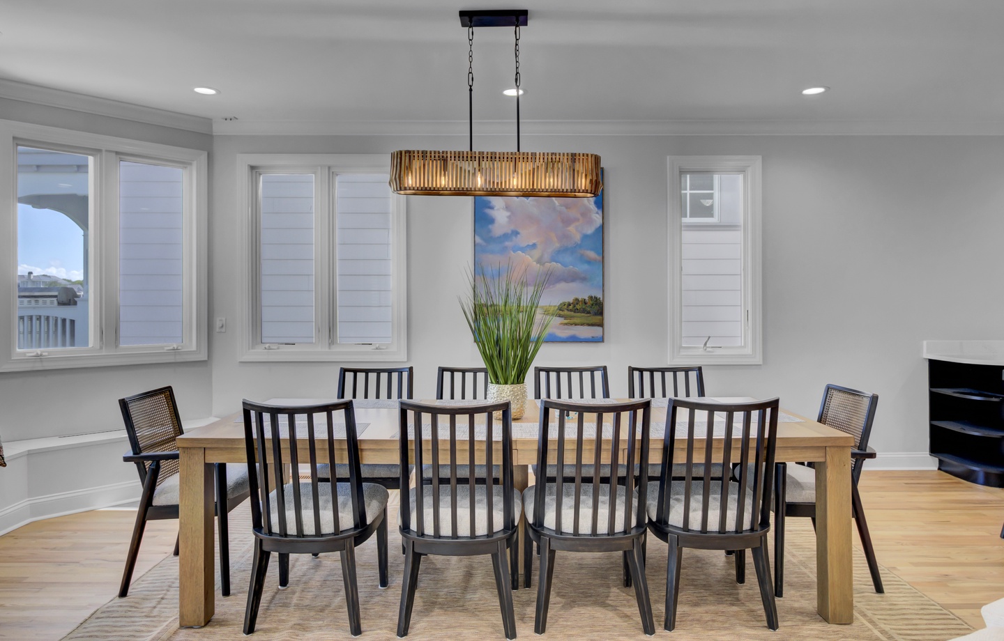 Gather around this elegant dining table where memorable meals and conversations await your group.