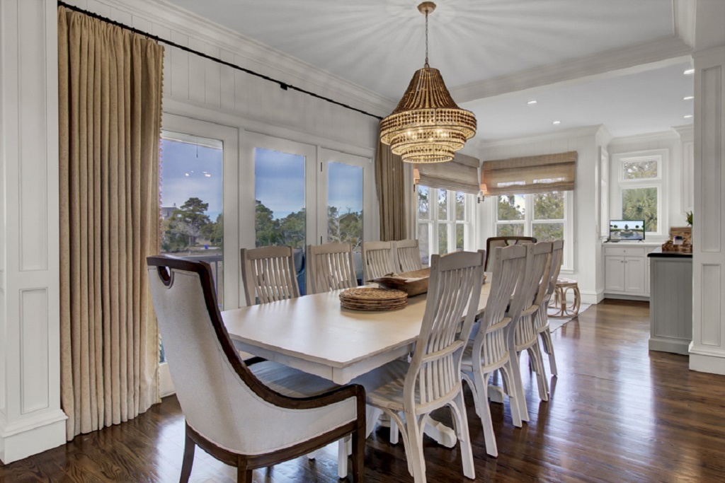 - Dine in elegance beneath a glowing chandelier and soft evening light - French doors open to let the breeze in for sunset dinners and wine nights - Perfect setting for shared meals, laughter, and unforgettable gatherings