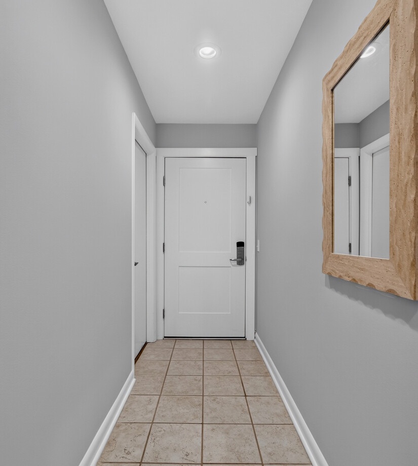 Step into your private retreat through this clean, well-lit entryway. Neutral tones and simple details set a calming stage for your vacation ahead.