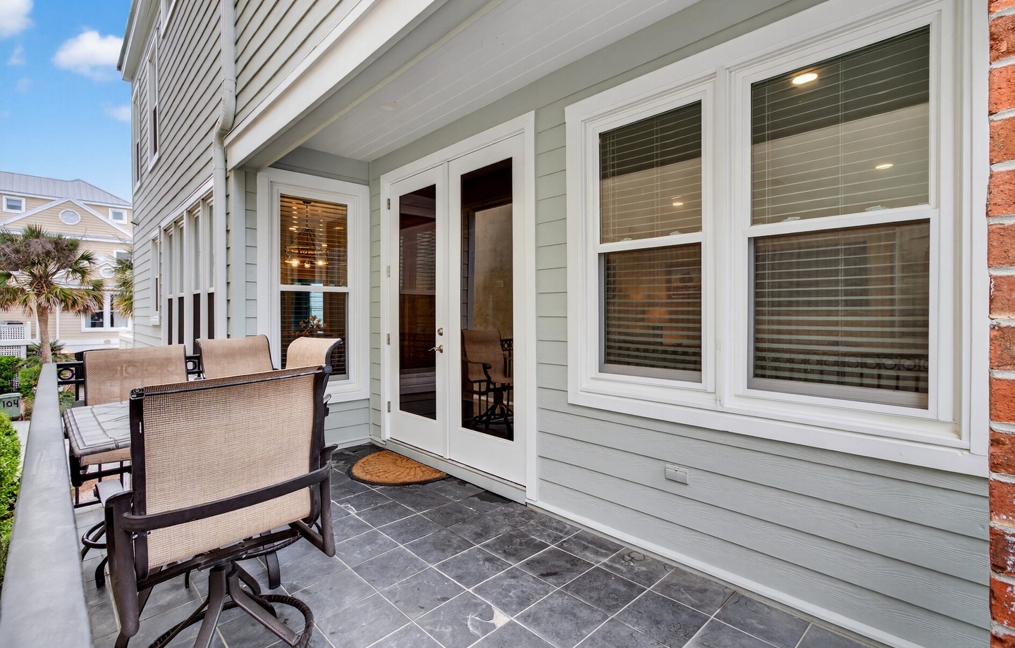 Unwind on your private balcony with comfortable seating, French doors opening to your bright interior.