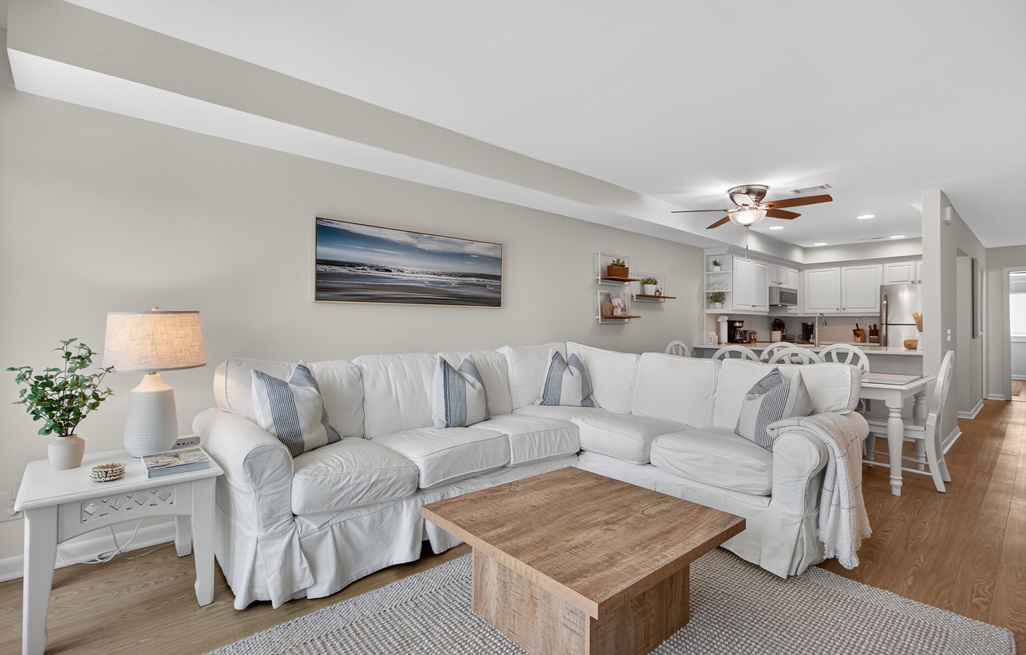 Comfortable living area with new coastal decor.