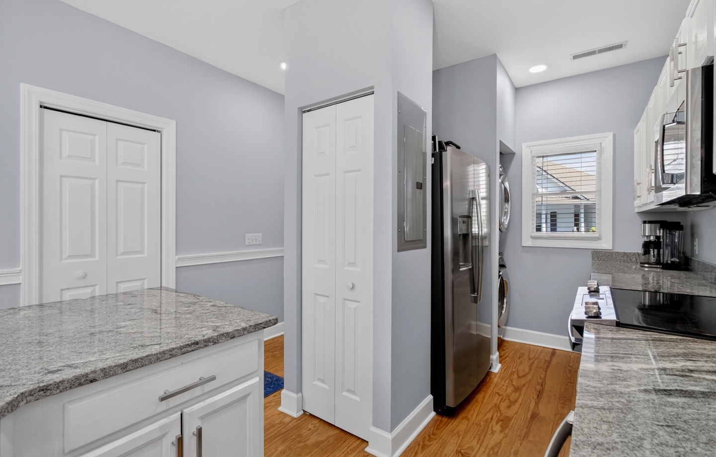 Your modern kitchen features granite countertops, stainless steel appliances, and convenient washer/dryer - perfect for preparing meals and staying fresh.