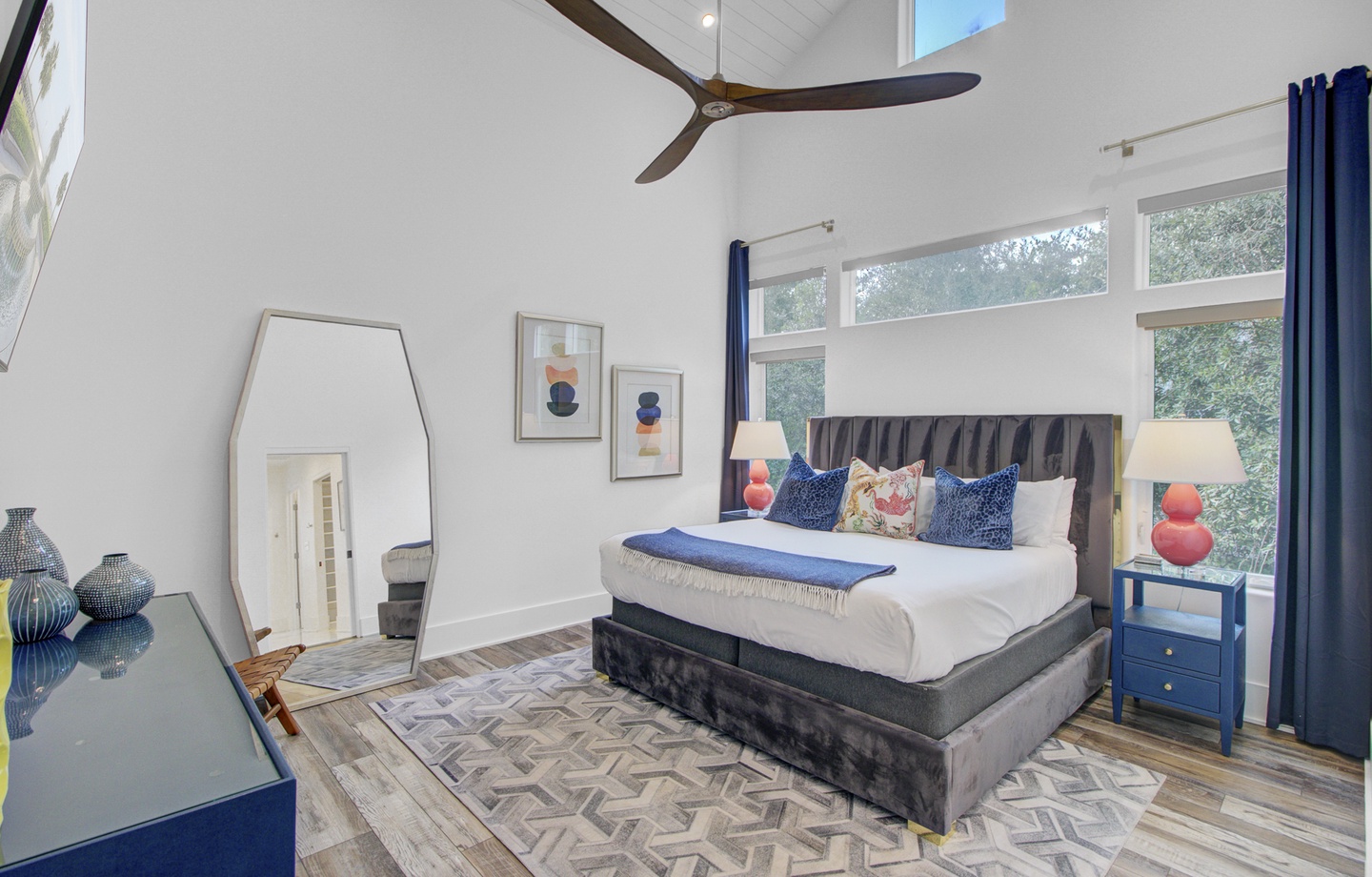 Relax in your bright bedroom with soaring vaulted ceilings, a cozy king bed, and modern touches that create the perfect retreat.