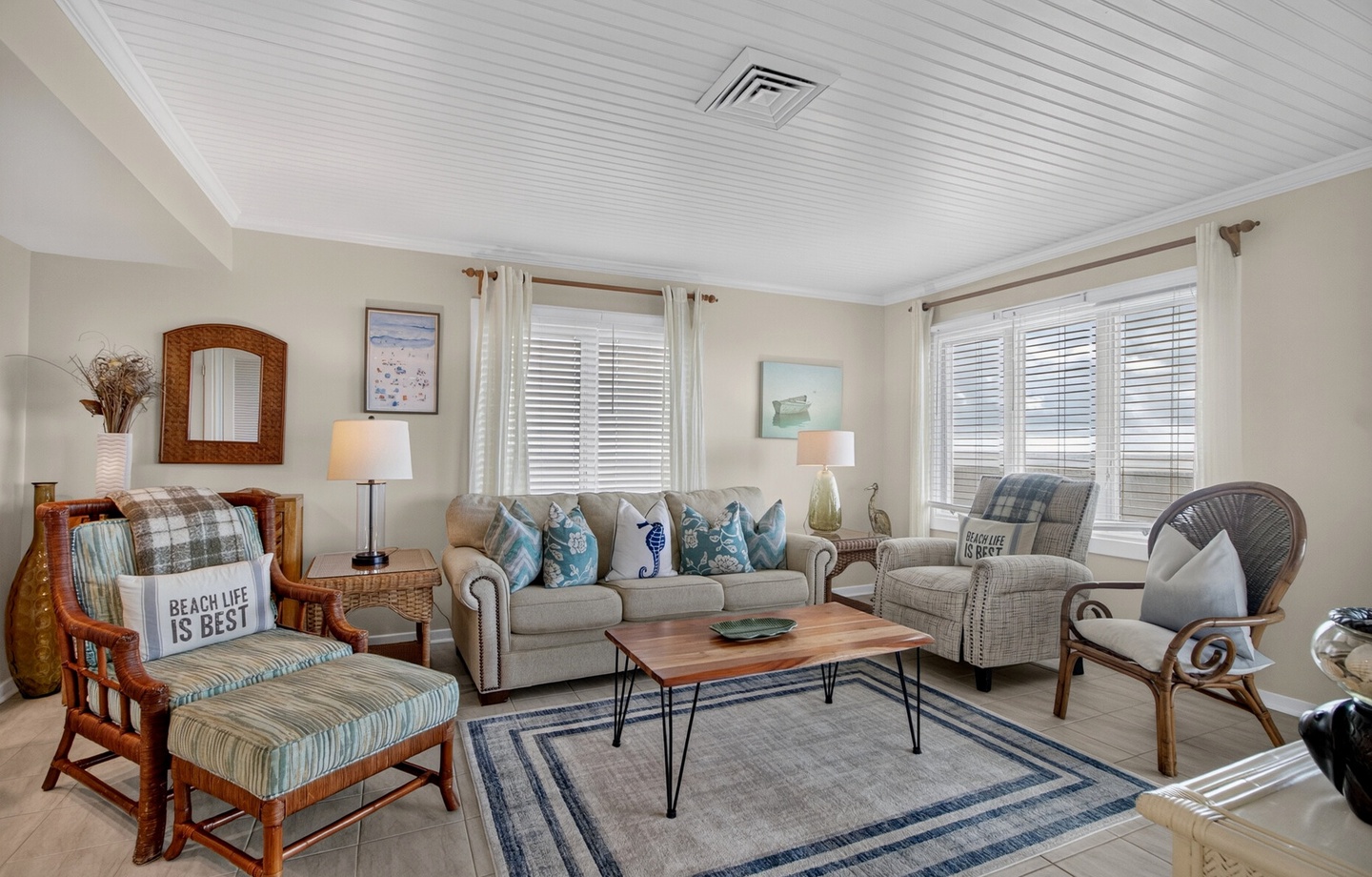 Settle into this welcoming coastal retreat where soft blue accents and beach-themed touches bring the ocean to your doorstep. Light-filled windows, comfortable seating, and thoughtful décor invite you to truly unwind.
