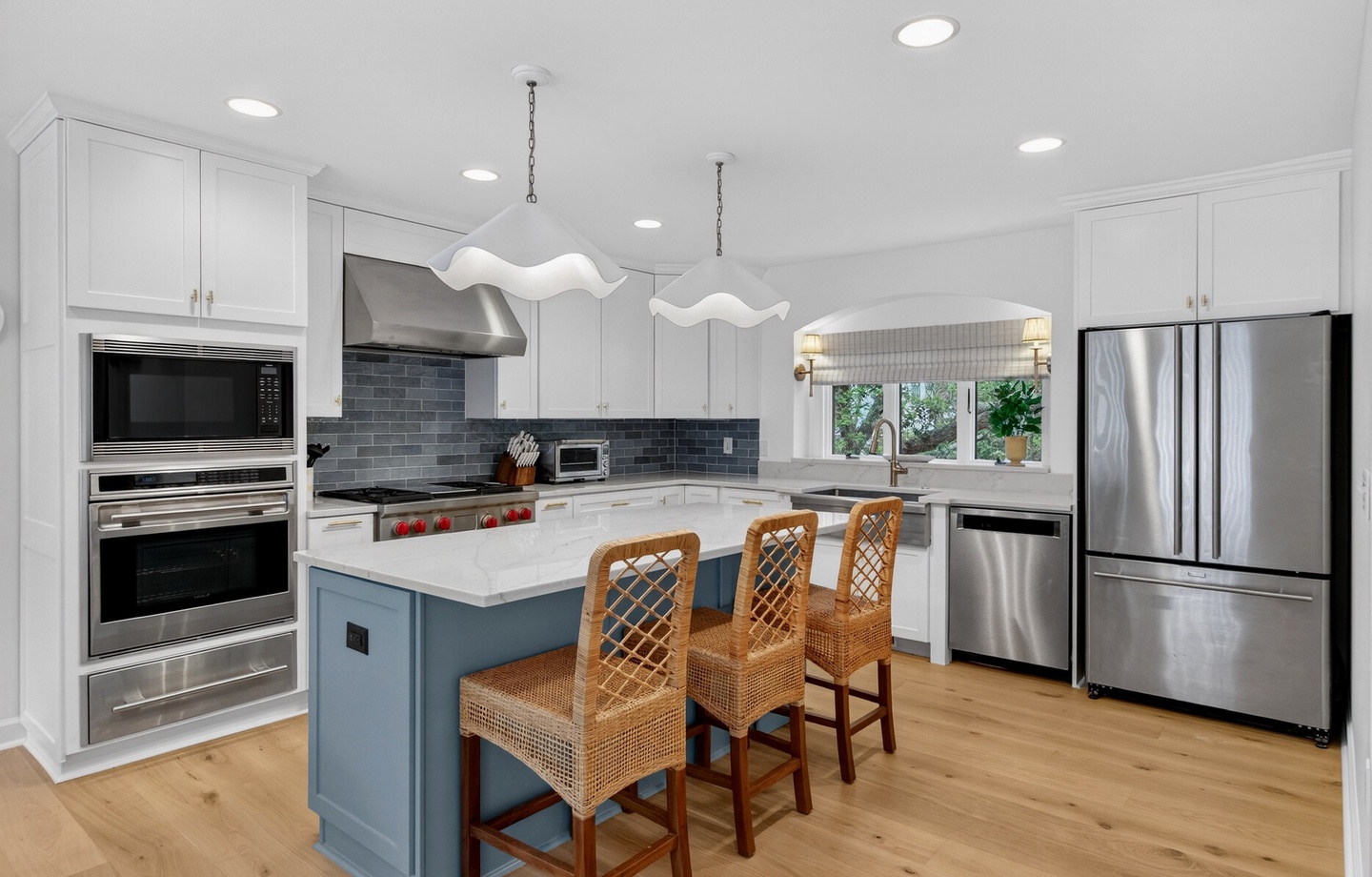 Your dream kitchen awaits with gleaming stainless appliances, marble counters, and a welcoming island perfect for morning coffee or evening meals.