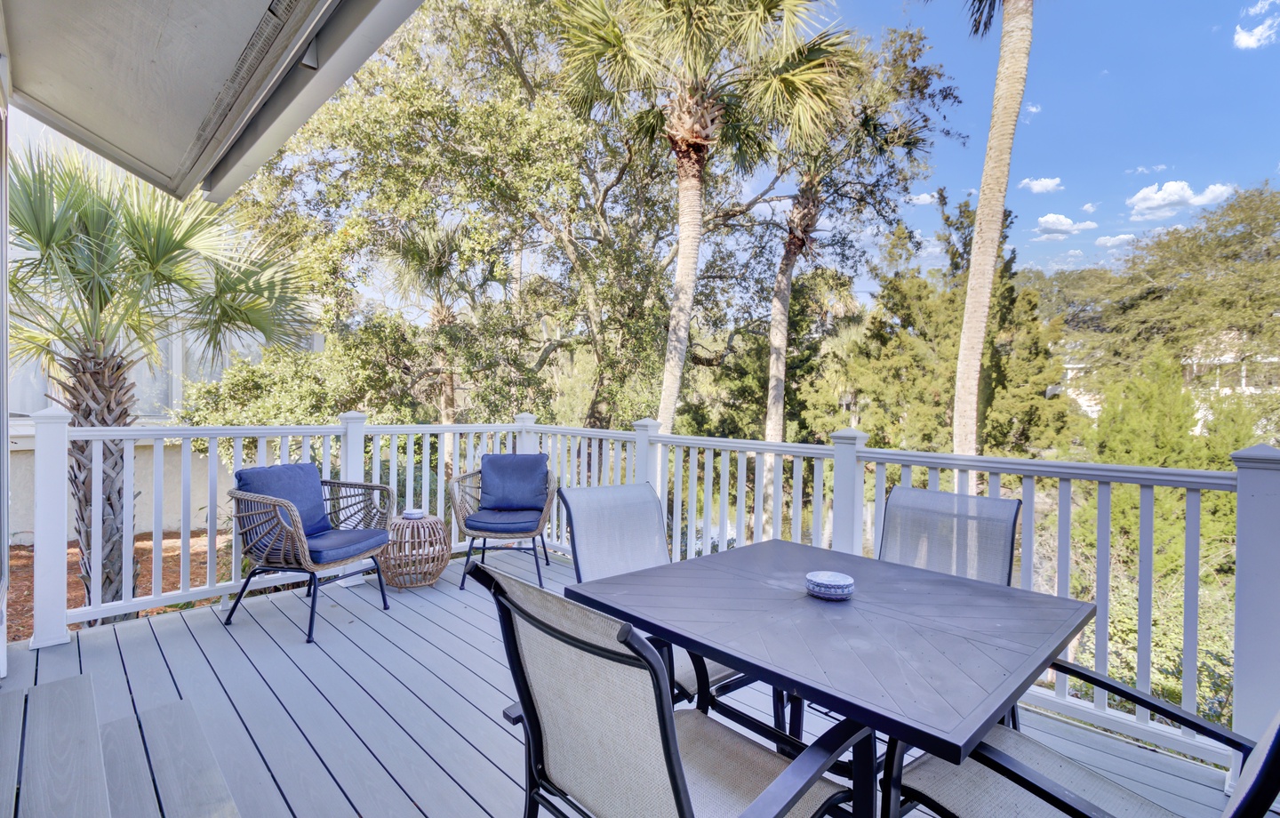 Relax on your private deck surrounded by swaying palms and lush greenery, where morning coffee and sunset dinners feel extra special.