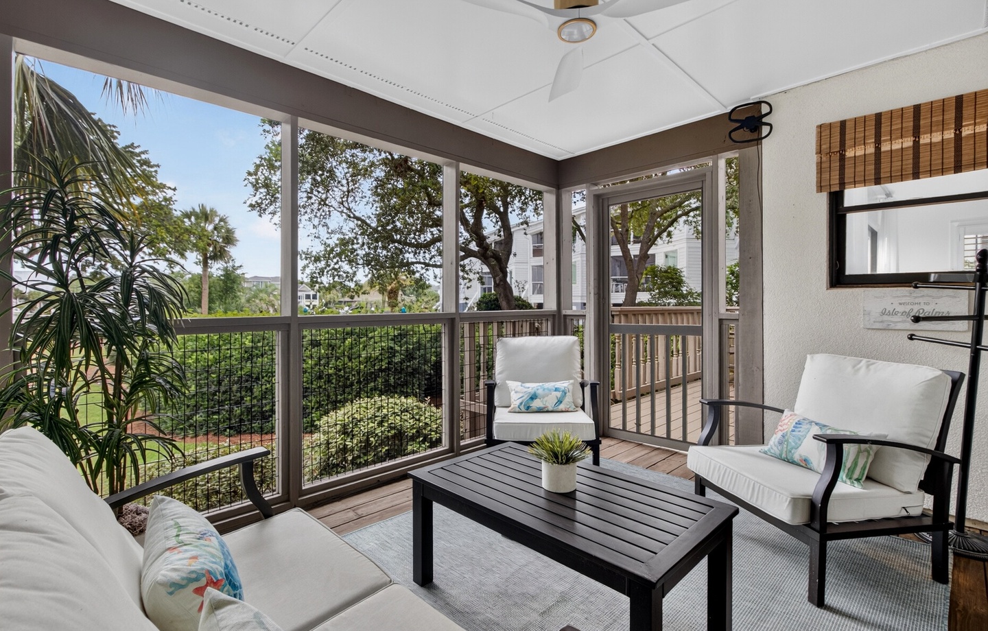 Picture yourself unwinding in this serene screened porch, where gentle breezes flow through and peaceful garden views invite you to relax. The perfect spot for your morning coffee or evening wind-down.