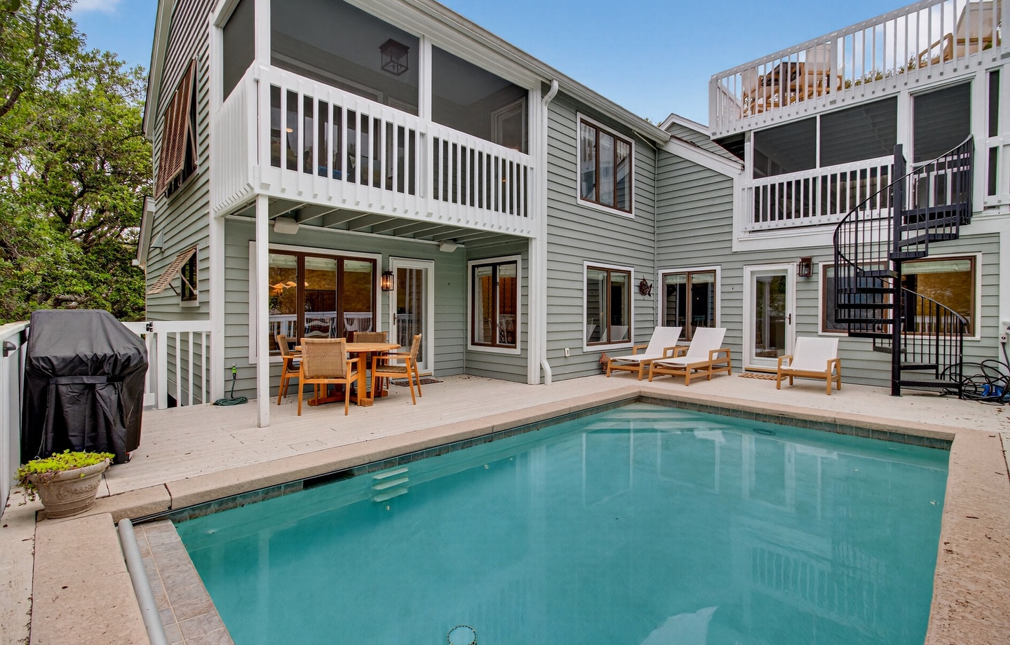 Your private pool awaits with teak loungers and outdoor dining for perfect poolside relaxation.