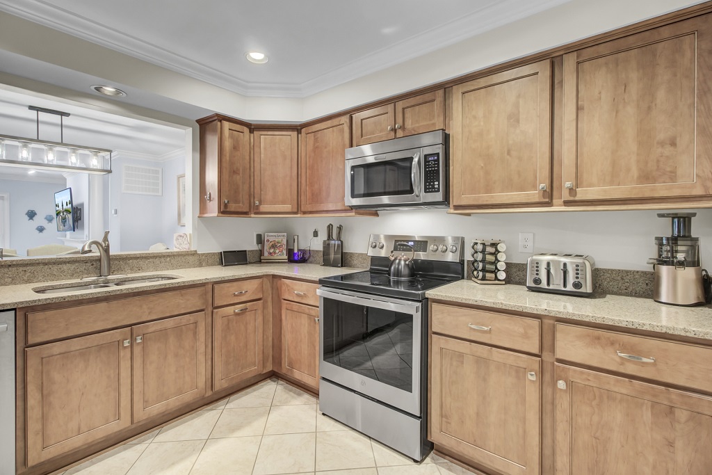 - Whip up vacation favorites in this sleek, well stocked kitchen with stainless appliances - Warm wood cabinets, granite counters, and everything you need to feel at home - Perfect for morning coffee, group meals, or midnight snacks