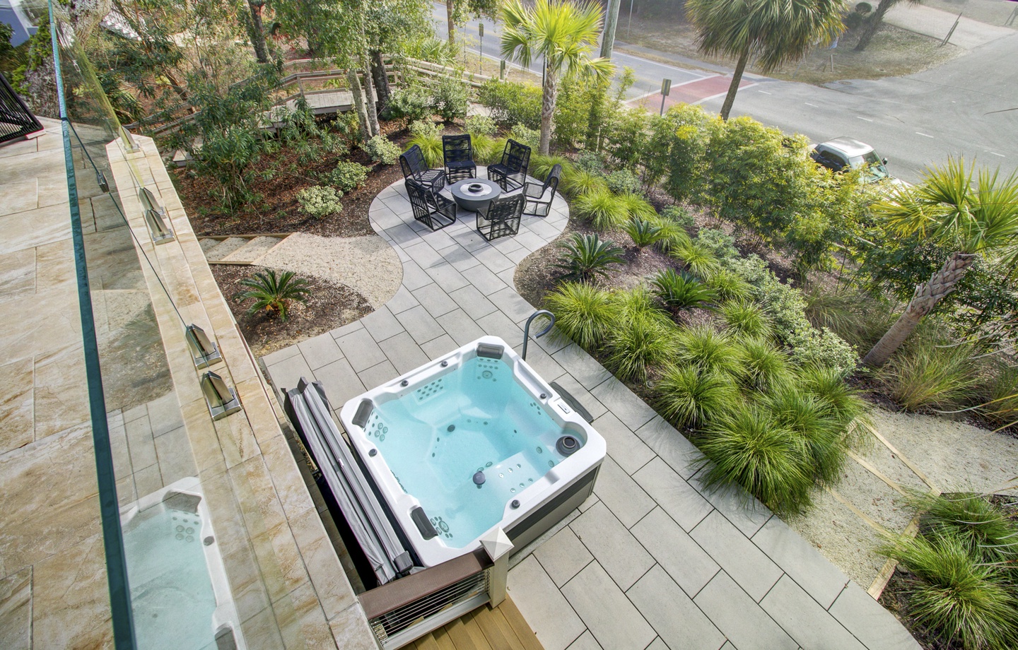 Soak away your stress in your private hot tub, surrounded by lush tropical gardens and peaceful outdoor dining space.