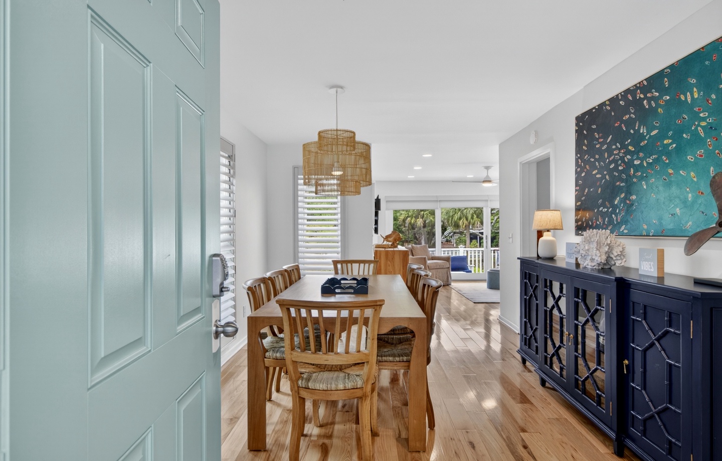 Gather around the warm wooden table under soft lighting, where delicious meals and lively conversations await. Coastal-inspired décor and natural light create a bright, welcoming atmosphere you'll love returning to.