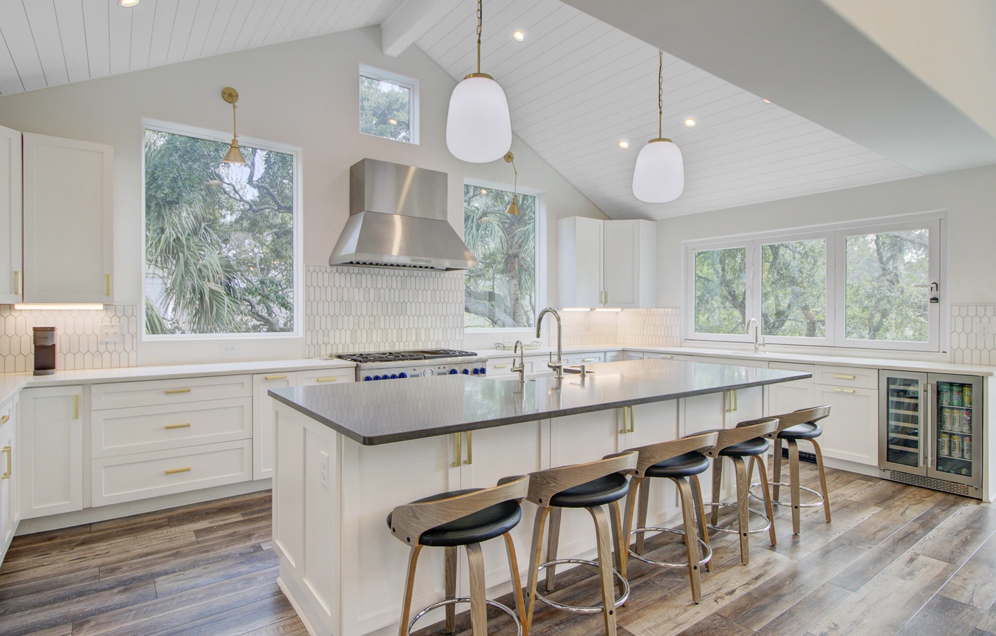 Your gourmet kitchen awaits with sleek countertops, modern appliances, and a spacious island perfect for cooking and gathering together.