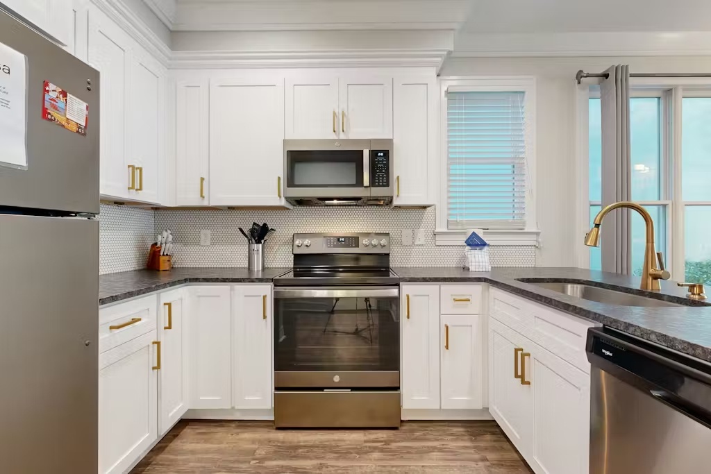 Your gourmet kitchen awaits with pristine white cabinets, granite counters, and stainless appliances for memorable meal preparation.