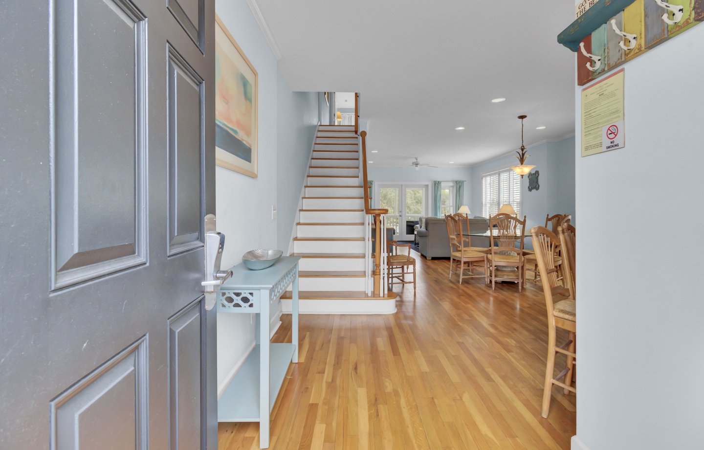 Step into your bright, open living space where gleaming hardwood floors flow seamlessly between dining and relaxation areas.