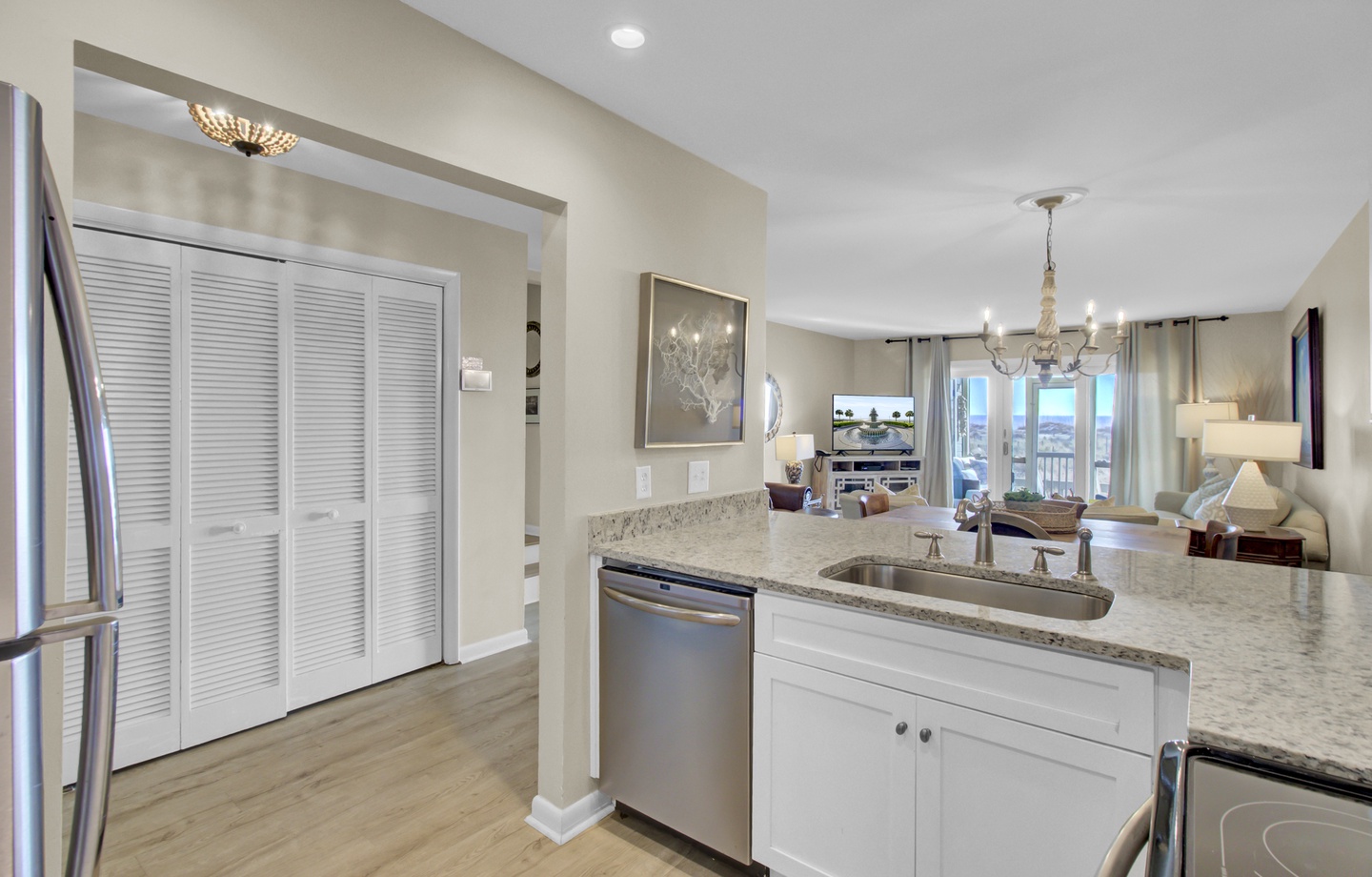 Your modern kitchen flows seamlessly into an elegant living space, featuring granite counters and stainless appliances for memorable meal preparation.