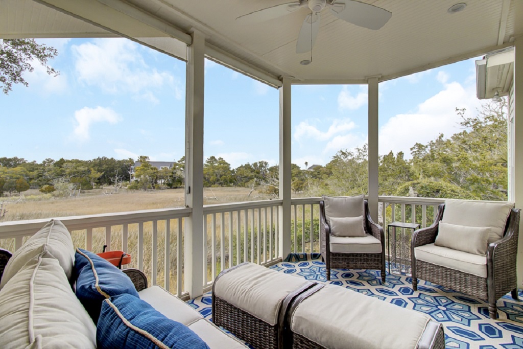 - Kick back on the screened porch with plush seating and peaceful marsh views - Enjoy the breeze without the bugs, perfect for morning coffee or sunset wine - Cozy outdoor living space that blends comfort, charm, and nature