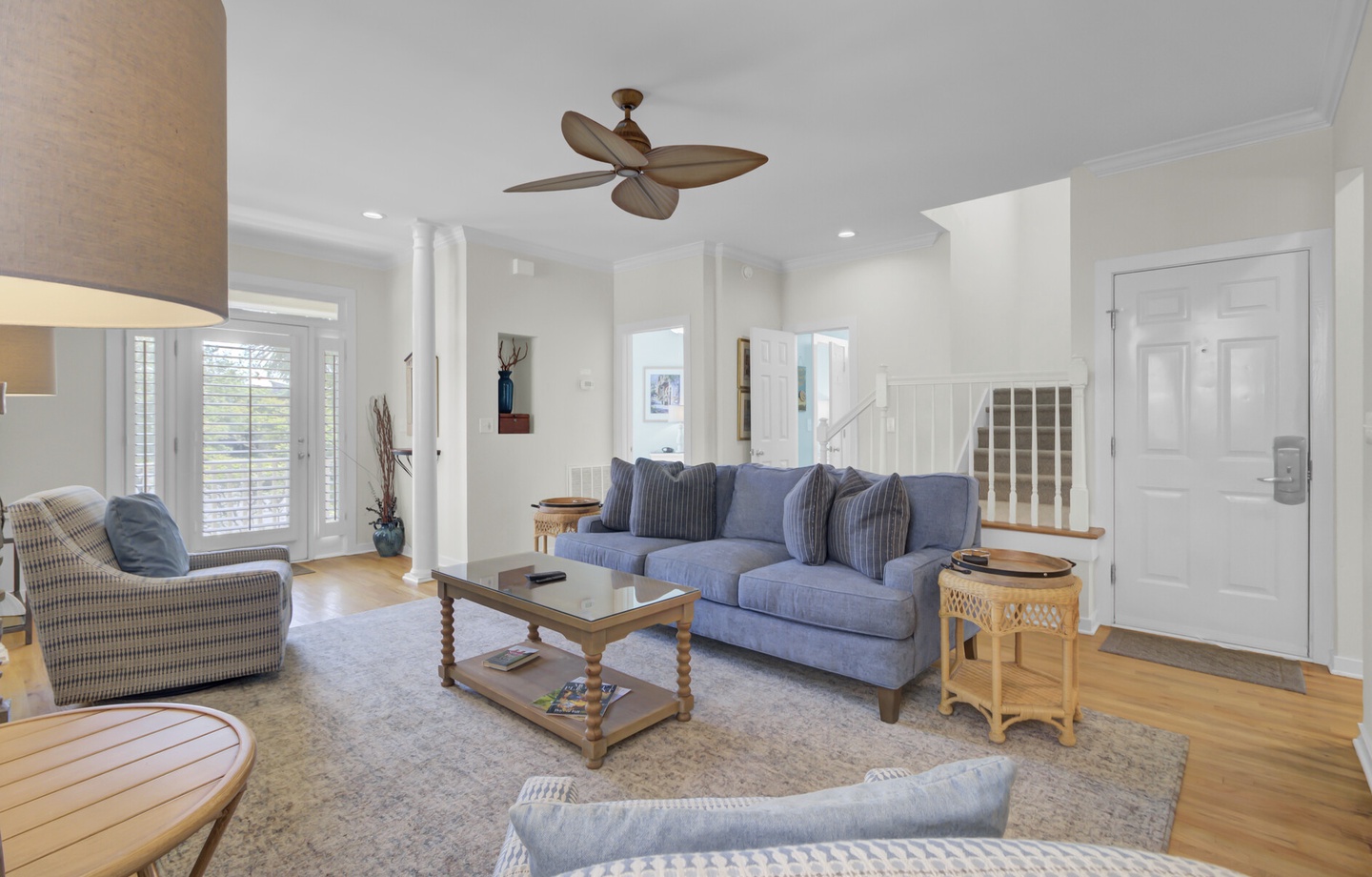Relax in your bright, airy living space with soaring ceilings, comfy seating, and natural light streaming through.