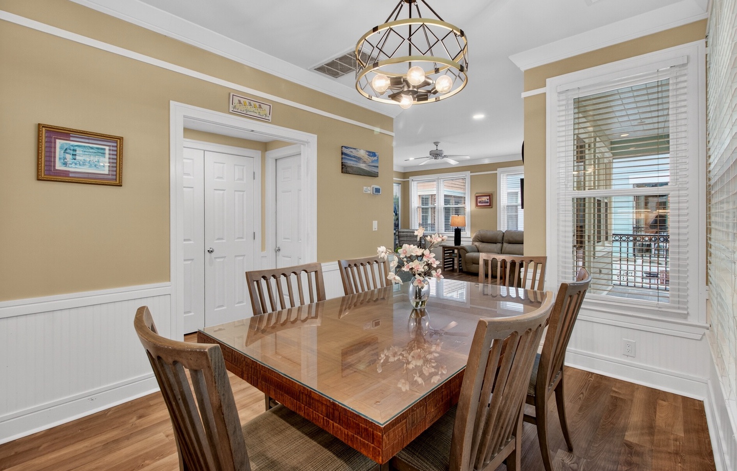 Gather around your elegant dining table for memorable meals under beautiful pendant lighting.