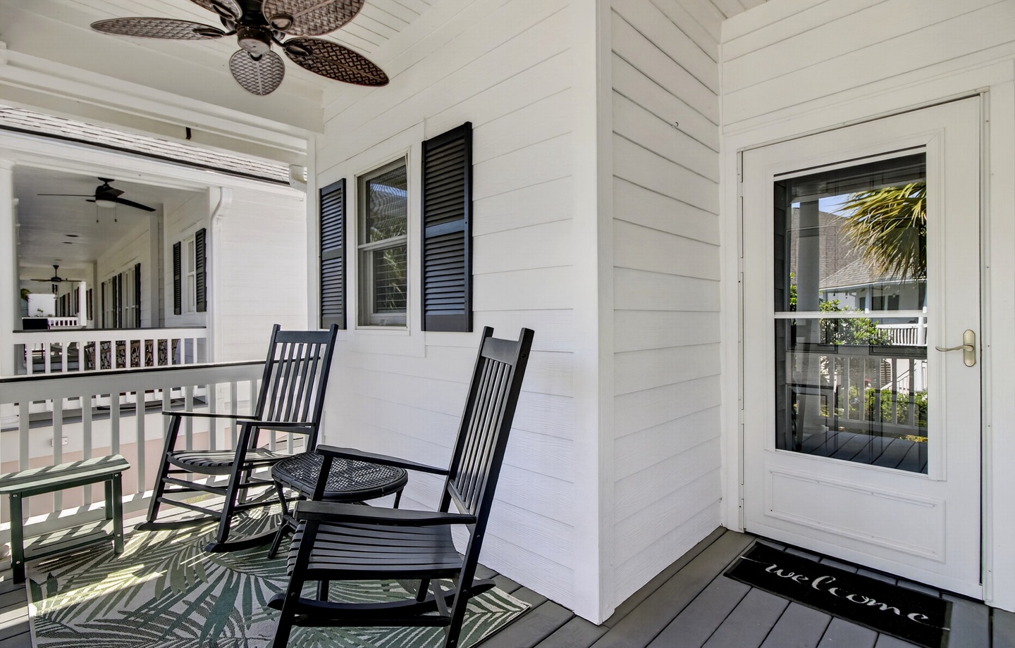Settle into your private porch with rocking chairs and tropical breezes, where morning coffee tastes better under the ceiling fan.