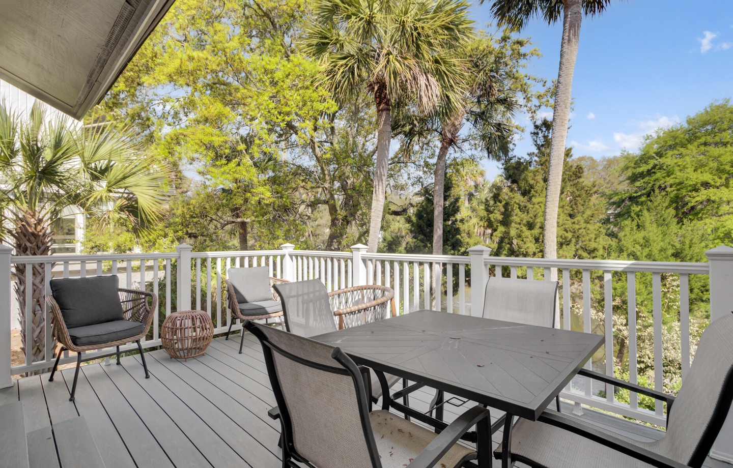 Step onto your private balcony and savor morning coffee while tropical palms sway in the breeze beyond the peaceful treetop canopy.