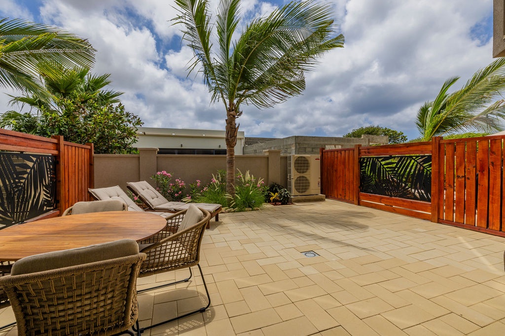 Step outside to your private patio, where cushioned lounge chairs invite you to sit back, soak up the sunshine, and enjoy a relaxing moment.
