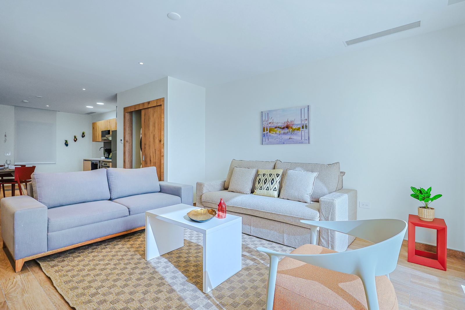 Settle into this bright, open living space with modern furnishings and a soothing color palette that invites you to unwind after a day exploring the area.