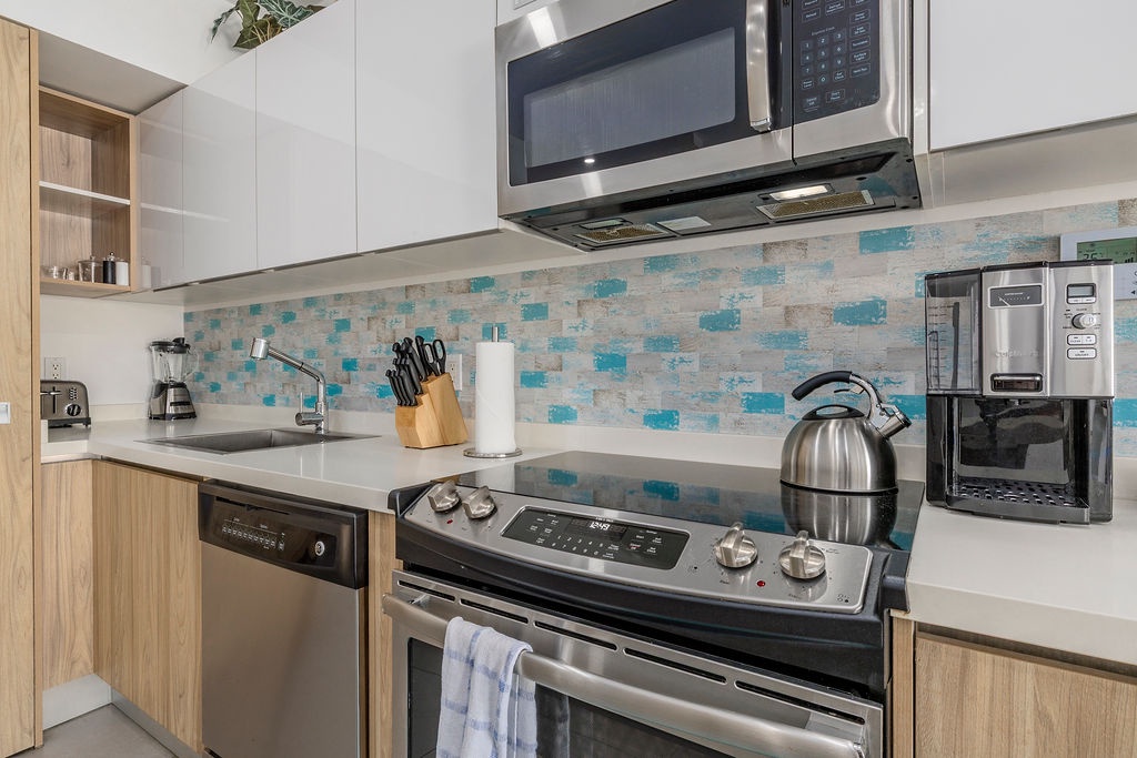 Your fully equipped kitchen makes meal prep a breeze with modern stainless appliances and all the essentials at your fingertips.