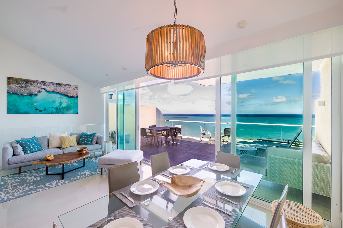 Dining area, living room and balcony access