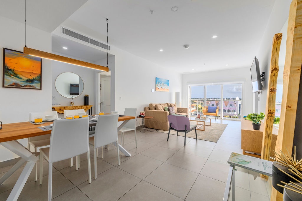 Step into your bright, modern sanctuary where sleek design meets comfort—perfect for memorable meals and relaxing evenings together.