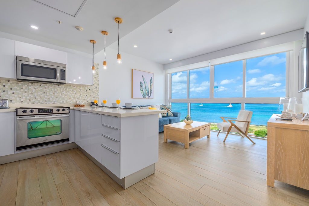 Wake up to breathtaking ocean views from your stylish kitchen and living space, where modern design meets coastal serenity.