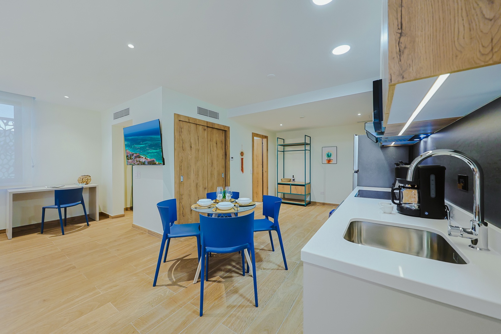 Settle in at your bright dining table for four, perfectly positioned between the open kitchen and your relaxing workspace. Modern touches and warm wood accents make this your ideal home base.