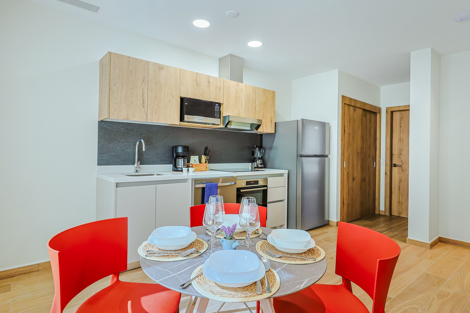 Your bright, well-equipped kitchen awaits, complete with modern appliances and a cheerful dining spot where you can savor home-cooked meals together.