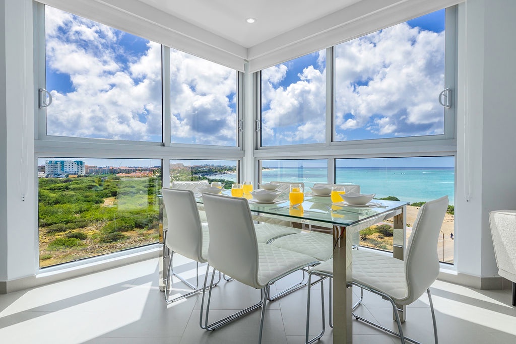 Savor breakfast with breathtaking ocean views from your elegant dining corner, where panoramic windows frame the azure coastline perfectly.