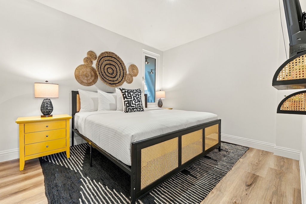 Sink into crisp, white linens and unwind in your serene bedroom, where warm wood floors and thoughtful design details create the restful escape you deserve.