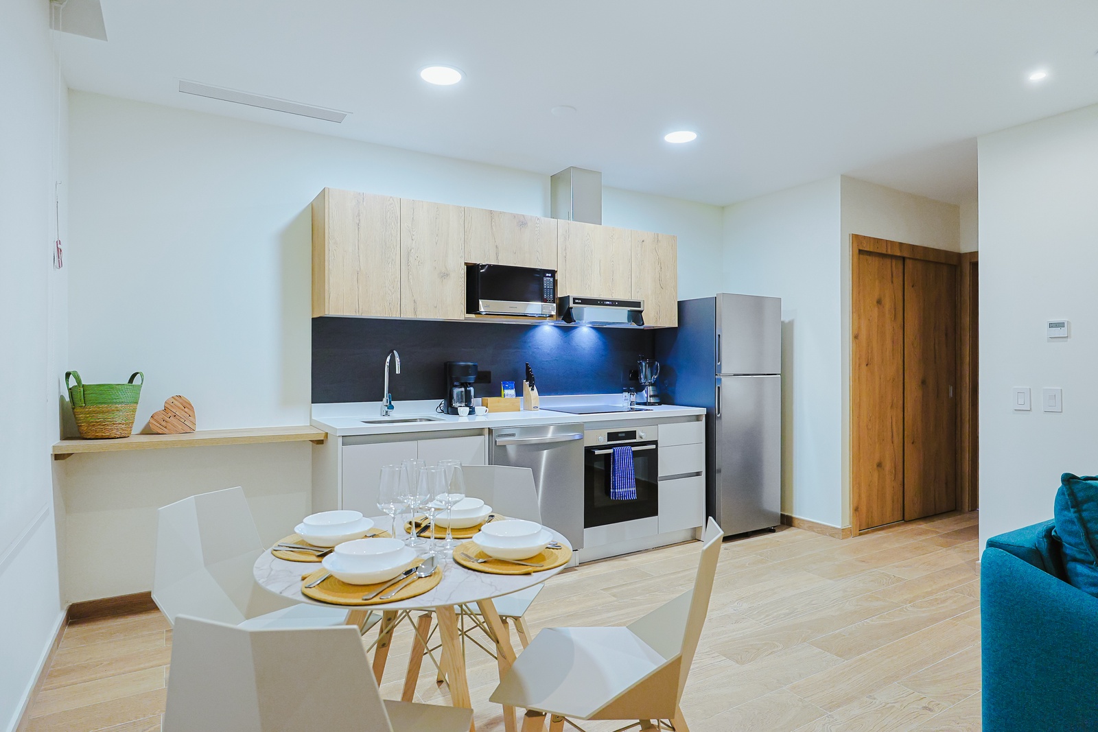 Your fully equipped kitchen is ready for you, with modern appliances, sleek countertops, and a cozy dining nook where you can savor meals together.