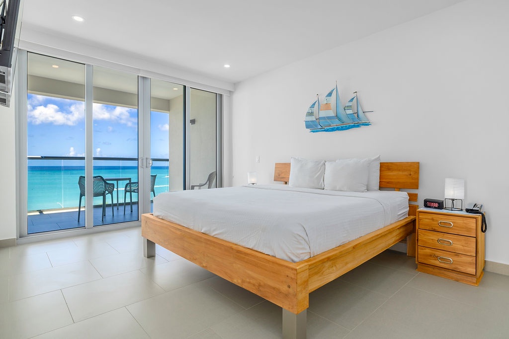 Wake up to breathtaking ocean views from your comfortable bed, with turquoise waters stretching endlessly beyond your private balcony.