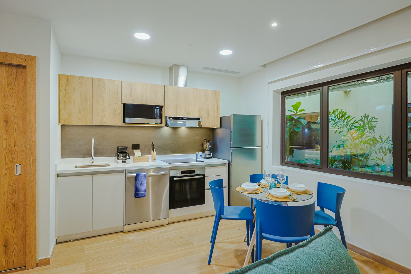 Step into your bright and fully equipped kitchen, where cooking feels effortless with modern appliances, sleek cabinetry, and a cozy dining space perfect for sharing meals together.