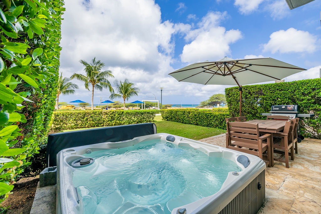Sink into your private hot tub while tropical breezes and ocean views create the perfect backdrop for relaxation.