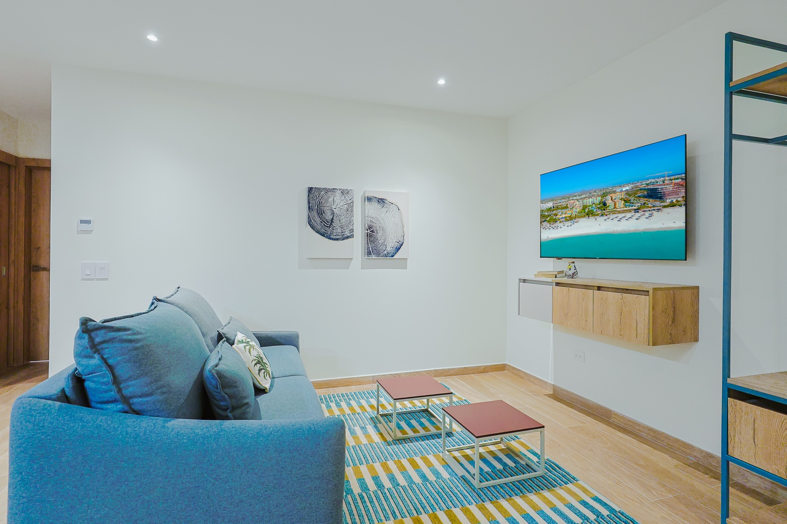 Unwind in your bright living space with plush seating and coastal tones that echo the beachside vibe. Your perfect home base for relaxing between adventures.