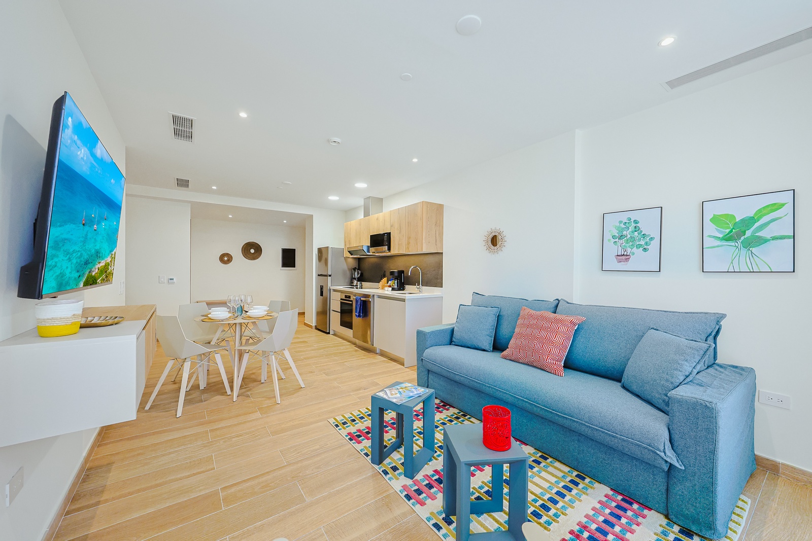 Step into your bright, modern retreat where coastal-inspired decor meets sleek design. Sink into the plush sofa, whip up a meal in your fully-equipped kitchen, and gather at the inviting dining table.