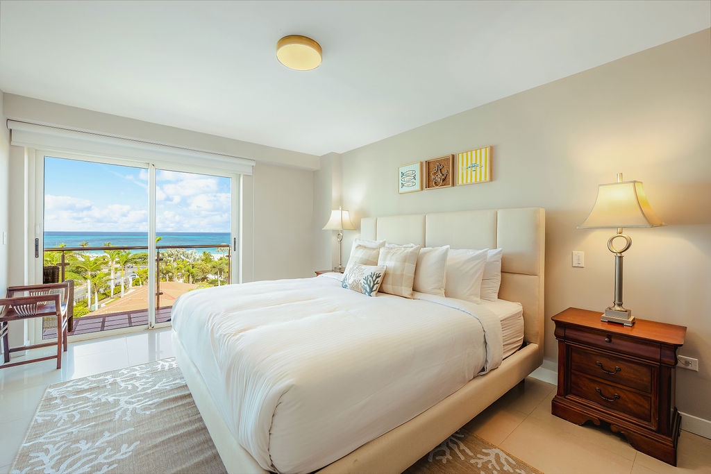 Wake up to breathtaking ocean views framed by your private balcony, where soft linens and coastal breezes promise peaceful mornings in your serene retreat.