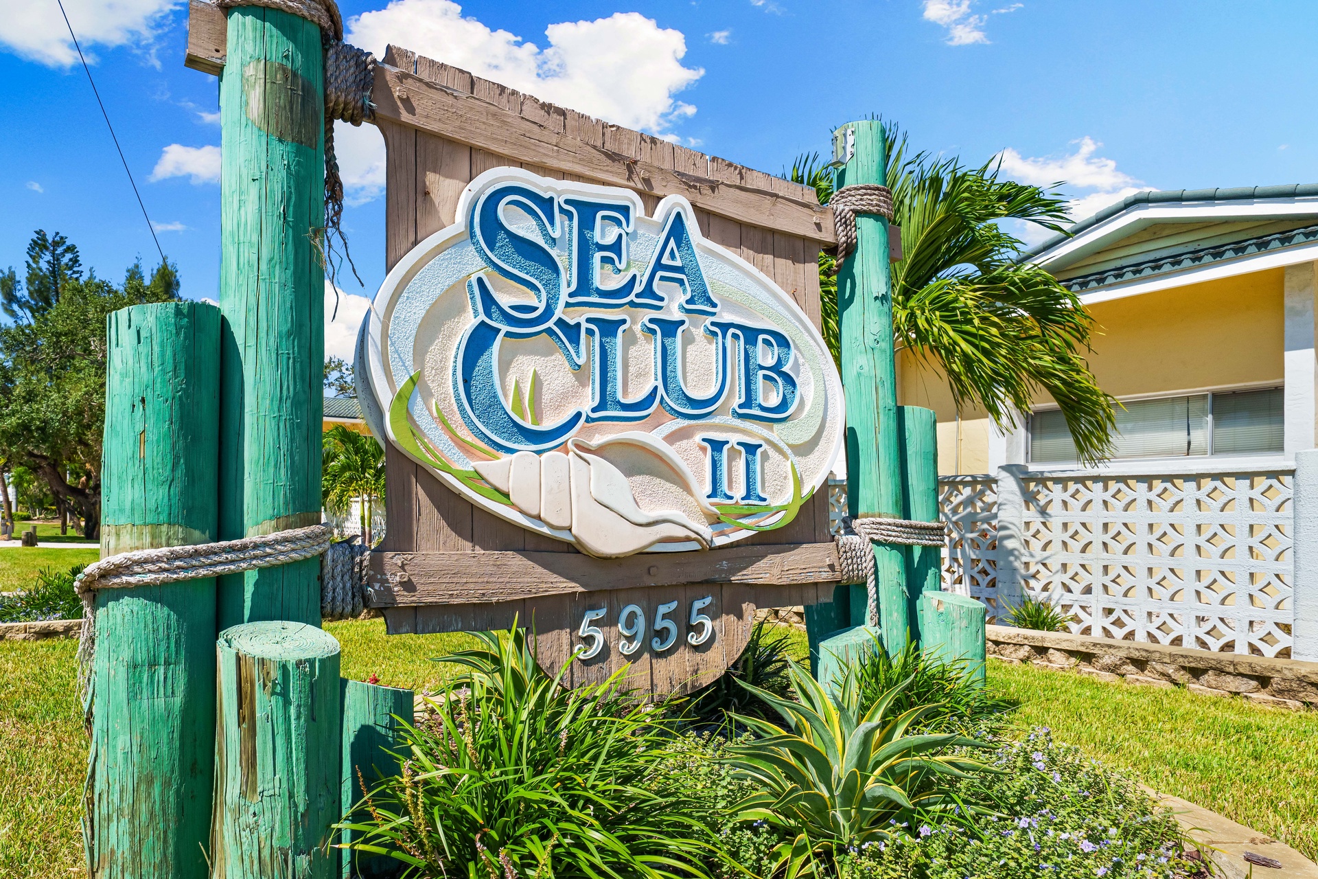 Welcome to Sea Club II, nestled in a sunny coastal setting with lush tropical landscaping and a relaxed beach-town atmosphere.
