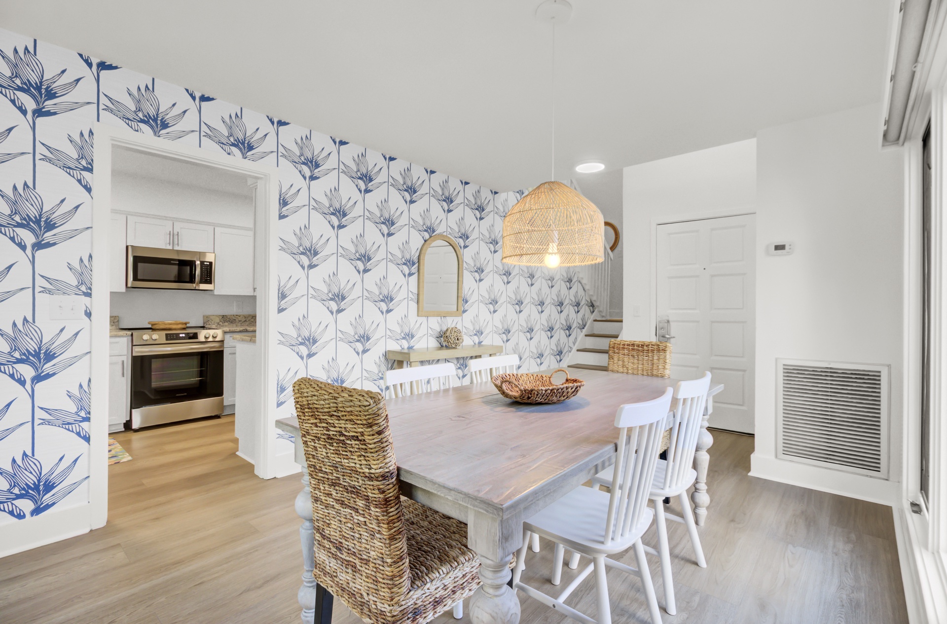 Gather around this charming dining table where coastal elegance meets comfort, perfect for memorable meals with loved ones.