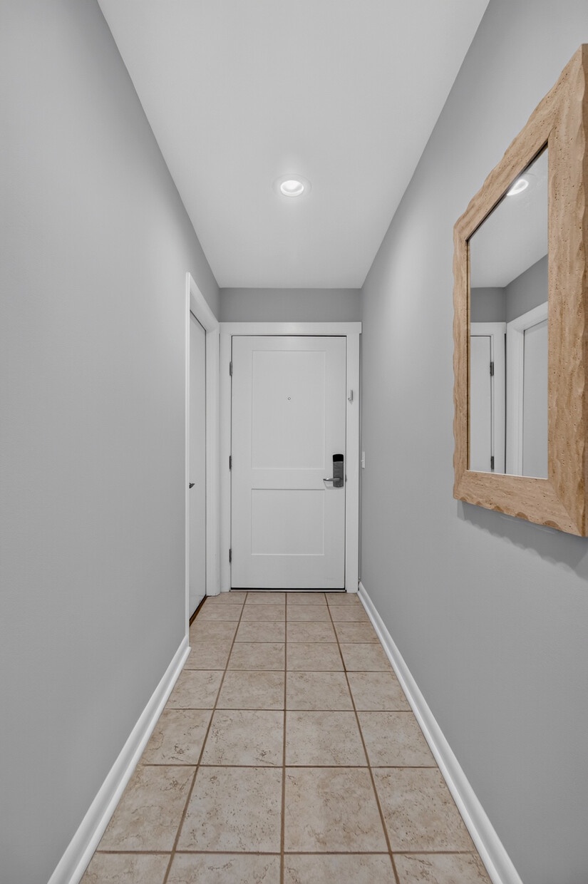 Step into your private retreat through this clean, well-lit entryway. Neutral tones and simple details set a calming stage for your vacation ahead.